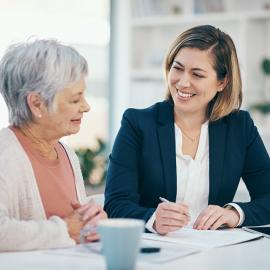 Senior woman speaking to a financial professional.